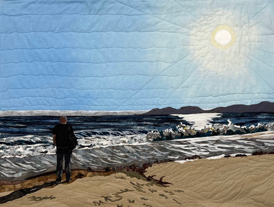 ocean textile art with man on shore
